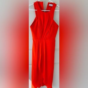 Stunning dress in bright orange, knee length, fluttering shoulder style